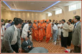 Swamishri walking through the main area of Luton Mandir