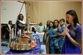 Young Yuvatis offer their devotion to Harikrishna Maharaj in the Tula