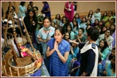 Young Yuvatis offer their devotion to Harikrishna Maharaj in the Tula