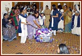 The sacred image of Harikrishna Maharaj being brought into the programme