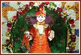 Ghanshyam Maharaj adorned with colourful flower garments