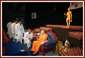 Swamishri viewing the exhibition prepared by kishoresSwamishri meets some kishores after puja