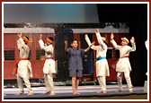 Children performing dances during the train journey