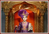 Ghanshyam Maharaj adorned with colourful flower garments
