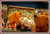 Senior sadhus present Swamishri with a beautiful shawl prepared by the Mahila Mandal