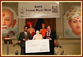 Rt. Hon. Charles Kennedy MP presents the BAPS cheque to Mr Ramli Sau'ud, Minister Counsellor from The Embassy of the Republic of Indonesia