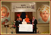 Rt. Hon. Charles Kennedy MP presents the BAPS cheque to H. E. Mr Vikrom Koompirochana, The Ambassador from The Royal Thai Embassy