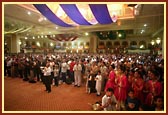 Devotees offer prayers and celebrate the birth of Bhagwan Swaminarayan and Lord Ram in the evening assembly