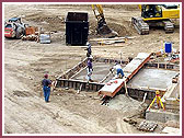 Pouring of all foundation walls and a grand stair 