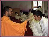 Pujya Haridarshan Swami placed a mark of kumkum on kishores foreheads, hoping for them to progress in satsang