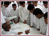 Registration volunteers were briefed as to their sevas 