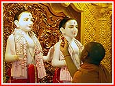 After Swamishri performed the murti-pratishta rituals in India, the deities are ritually being installed by sadhus in the mandir