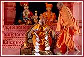 Swamishri is presented a garland of niyams (vows) prepared by the Edison Yuvati Mandal



