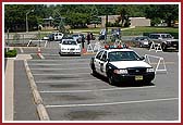 Swamishri receives a police escort to Edison Mandir