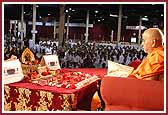 Swamishri doing mala while chanting 