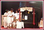 Youths perform a humorous drama in the presence of Swamishri 