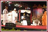 Youths perform a humorous drama in the presence of Swamishri