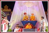 Swamishri watches the balaks' performance during the cultural program 