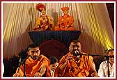 Saints engaged in singing kirtans with much devotion 