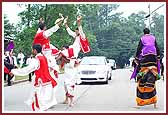 Youths display their spirit as they lead Swamishri's convoy  