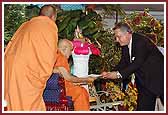 The participant saints receive blessings from Swamishri after the game