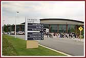 Devotees enter the Gwinnett Center Arena for the program