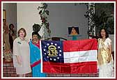State Representative for Dekalb county, Jill Chambers, presents the new Georgia flag 