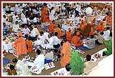 Swamishri, saints, and devotees perform the mahapooja for the Shilanyas Vidhi 
