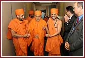 Swamishri walks through the gate at Los Angeles International Airport 