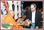  Swamishri is greeted by Bryan Rogers 