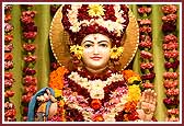 Bhagwan Shri Swaminarayan adorned with fresh flowers 
