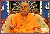  Swamishri with a flower in hand at the end of his morning pooja 