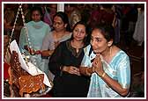  West Coast Mahila Mandal offer their devotion to Shri Harikrishna Maharaj during the Pushpa Tula Utsav  