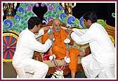 Swamishri is presented with a garland of raakhdis made by the Los Angeles Yuvati Mandal