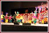 Youths dance joyously in front of Swamishri 