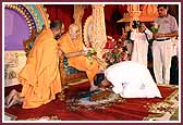  Swamishri is greeted by devotees
