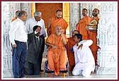 Swamishri examines the domes of the Mandir 