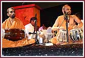 Saints and yuvaks conduct a kirtan aradhana