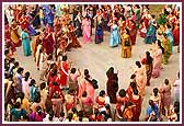 Women display their devotion in front of the Mandir in a traditional garba