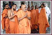   Swamishri on his way to have darshan of the Guru Parampara 