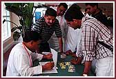 Volunteers register to help out during the convention