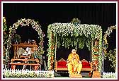 Swamishri sits on a swing to mark the beginning of the Hindolo Utsav