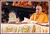  Swamishri does the mala during pooja  