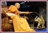  Swamishri sprays Shri Harikrishna Maharaj with colored water