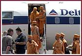 Swamishri deplanes the aircraft in Toronto, Canada