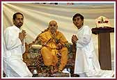 Kishore karyakars offer a garland made by the kishori mandal to Swamishri