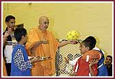   Swamishri blesses and laughs with the balaks 