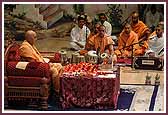 Swamishri performs dhyaan during his morning puja as saints sing kirtans
