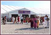 Devotees enter the assembly hall for the Vishvashanti Mahayagna