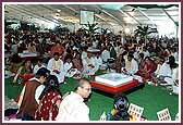 Devotees and aspirants wait to do darshan of the murtis and mandir        